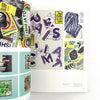 Collage of graphic design posters with various text and abstract elements on a white background.