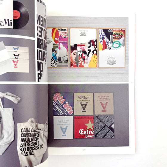 Display of various posters and a tote bag with text and graphics.
