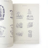 Open book displaying various black and white illustrations on a white background