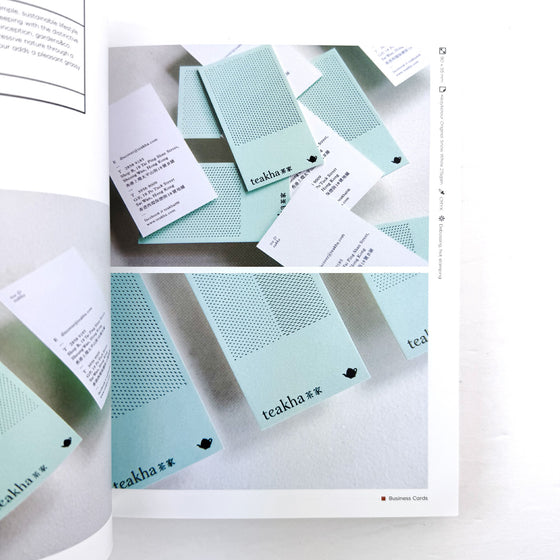 Teal cards with perforated designs and 'teakha' branding on a white background