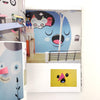 Children's room with cartoon character wall art and furniture