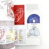 Collection of booklets with geometric designs and text on a white background