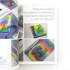 Colorful book with iridescent cover and text about manipulating angles to catch light.