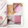 Collage of pink and gold greeting cards with floral designs.