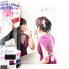 Magazine cover with a woman applying makeup and another in a pink dress, featuring Miu Miu branding.